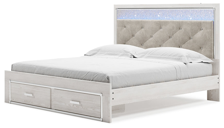 Cama Altyra tapizada con almacenaje, cómoda con espejo y mesita de noche