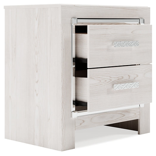 Cama Altyra tapizada con almacenaje, cómoda con espejo y mesita de noche