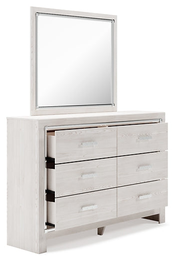 Cama Altyra tapizada con almacenaje, cómoda con espejo y mesita de noche