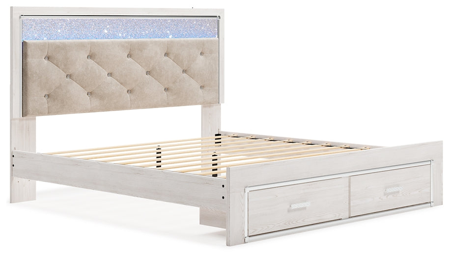 Cama Altyra tapizada con almacenaje, cómoda con espejo y mesita de noche