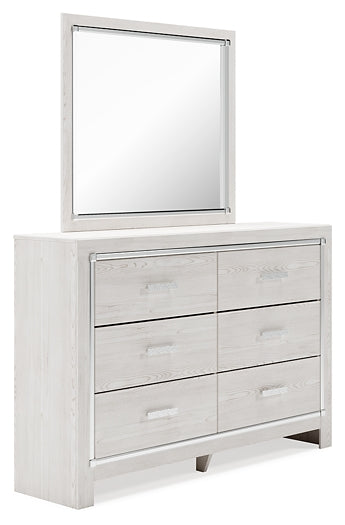 Cama Altyra tapizada con almacenaje, cómoda con espejo y mesita de noche