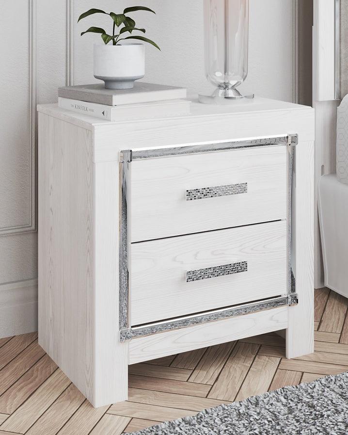 Cama Altyra tapizada con almacenaje, cómoda con espejo y mesita de noche