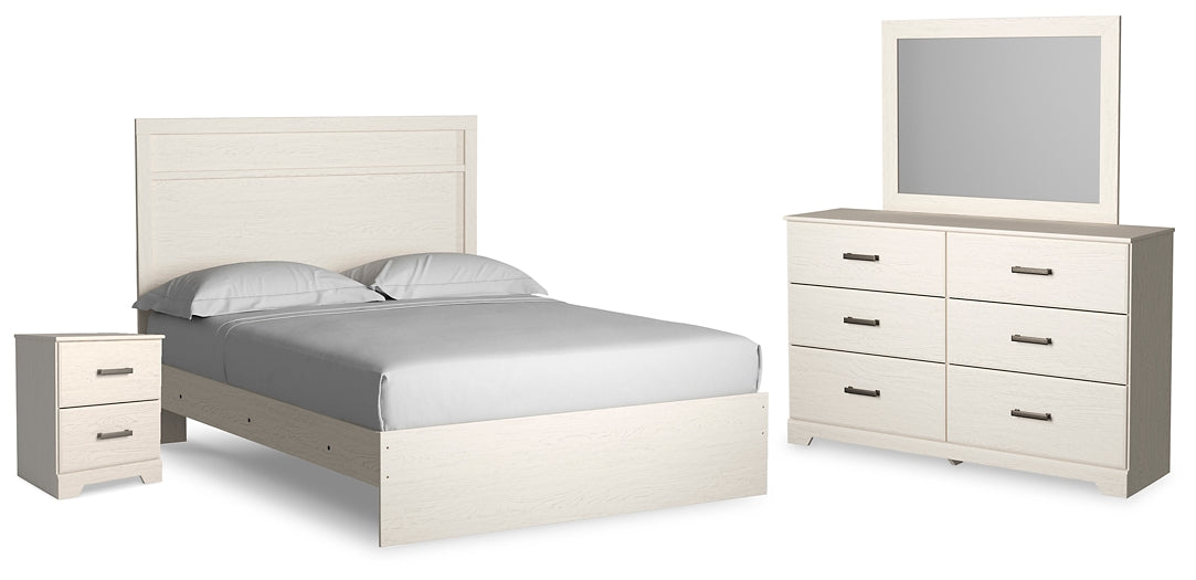 Cama Stelsie con paneles, cómoda con espejo y mesita de noche