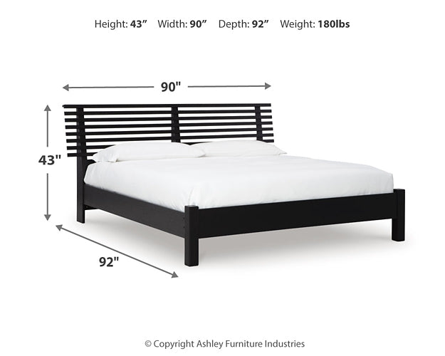 Cama con paneles Danziar y tocador con espejo