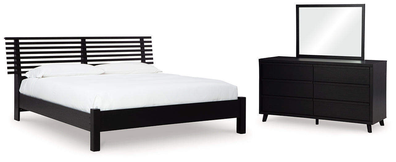 Cama con paneles Danziar y tocador con espejo
