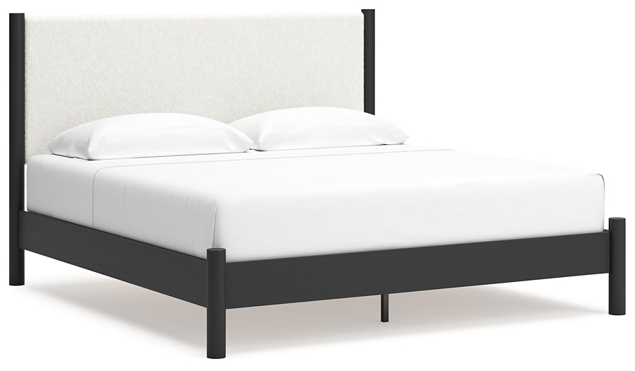 Cama Cadmori tapizada con paneles y cómoda con espejo
