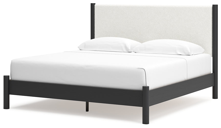 Cama Cadmori tapizada con paneles y cómoda con espejo