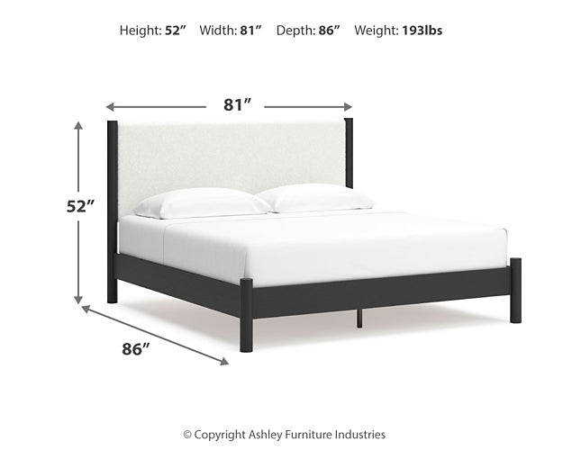 Cama Cadmori tapizada con paneles y cómoda con espejo
