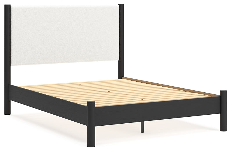 Cama Cadmori tapizada con paneles, cómoda con espejo y mesita de noche