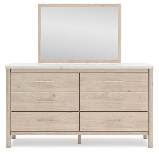 Cama Cadmori tapizada con paneles, cómoda y espejo