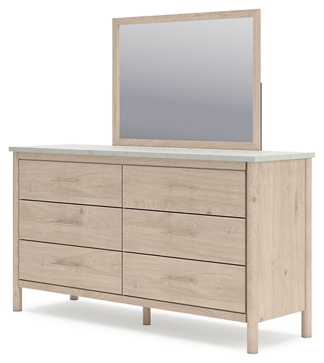 Cama Cadmori tapizada con paneles, cómoda y espejo
