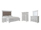 Cama con paneles Kanwyn, cómoda con espejo y mesita de noche