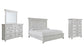Cama con paneles Kanwyn, cómoda con espejo y arcón