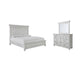 Cama con paneles Kanwyn y tocador con espejo