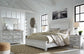 Cama con paneles Kanwyn y tocador con espejo