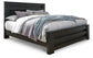 Cama con paneles Brinxton, tocador con espejo y mesita de noche