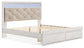 Cama Altyra tapizada con almacenaje, cómoda con espejo y mesita de noche