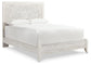 Cama Paxberry con paneles, tocador con espejo y mesita de noche