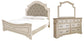 Cama tapizada con paneles y tocador con espejo Realyn California