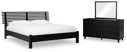 Cama con paneles Danziar y tocador con espejo