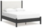 Cama Cadmori tapizada con paneles y cómoda con espejo