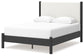Cama Cadmori tapizada con paneles y cómoda con espejo