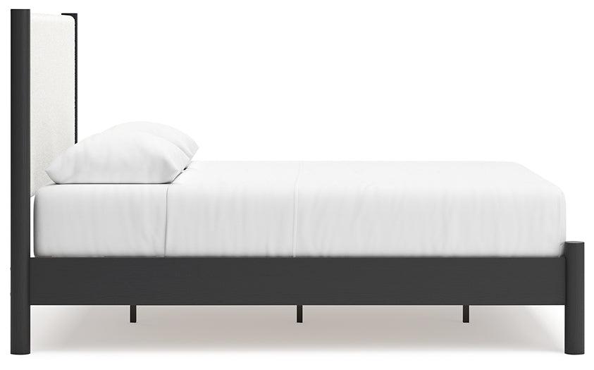 Cama Cadmori tapizada con paneles y cómoda con espejo