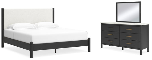 Cama Cadmori tapizada con paneles y cómoda con espejo