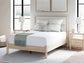 Cama Cadmori tapizada con paneles y cómoda con espejo