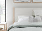 Cama Cadmori tapizada con paneles y cómoda con espejo