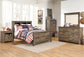 Cama con paneles y librería Trinell
