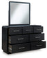 Cama tapizada Rowanbeck con paneles y tocador con espejo