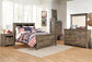 Cama con paneles y librería Trinell